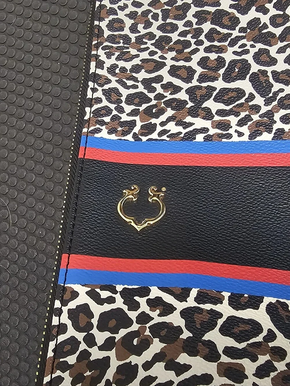 C. Wonder Animal Print Clutch with Red & Blue Stripes